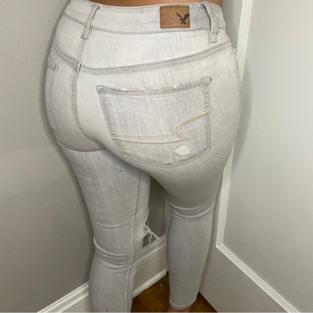 American Eagle grey super stretch low rise distressed jegging